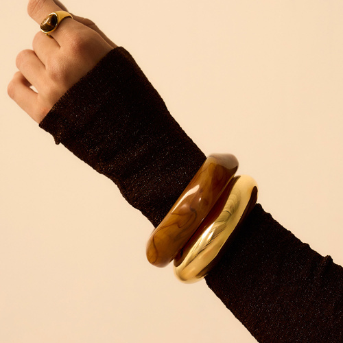 Złota sztywna bransoletka Bold